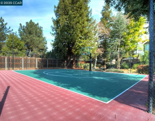 a room with gym equipment and large mirror