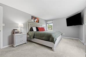 283 Brookwood Road Venetia, PA 15367 - Photo 14 of 36 a spacious bedroom with a bed and a flat screen tv