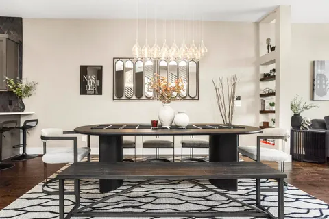 a living room with stainless steel appliances kitchen island granite countertop furniture and a view of living room