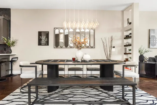 a living room with stainless steel appliances kitchen island granite countertop furniture and a view of living room