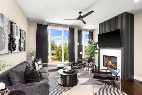 a bathroom with a double vanity sink toilet and shower