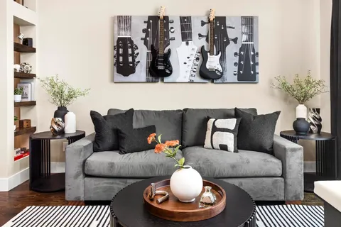 a large white kitchen with a large window a sink and stainless steel appliances