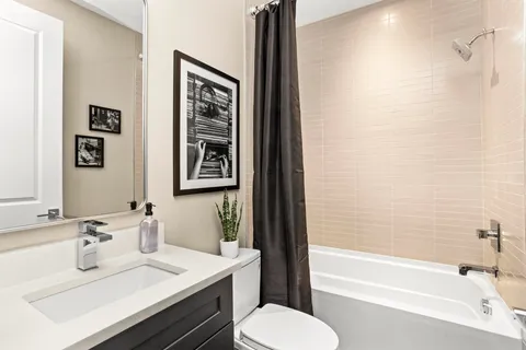 a bedroom with a bed and a potted plant