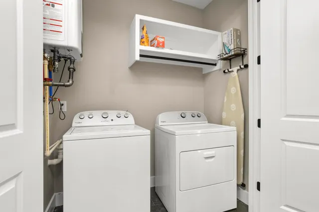 a bedroom with a bed potted plant and a flat screen tv
