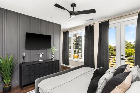 a dining room with furniture and wooden floor