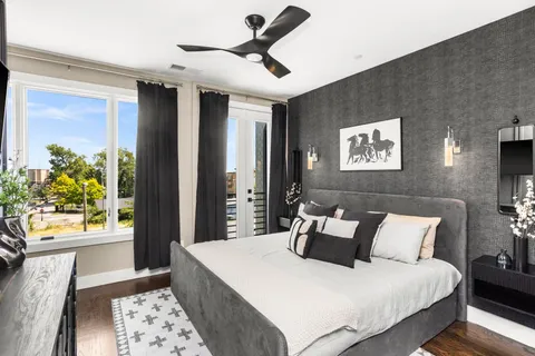 a kitchen with kitchen island granite countertop a sink refrigerator and cabinets