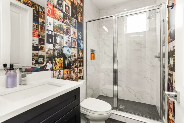 a living room with furniture a lamp and a large window