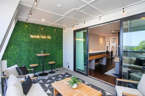 a bathroom with a double vanity sink toilet and shower