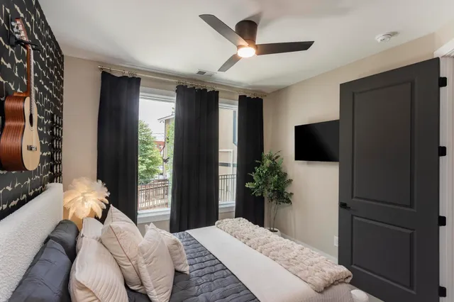 a outdoor living room with furniture and a large window