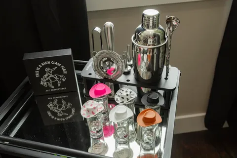 a bedroom with a bed and a potted plant