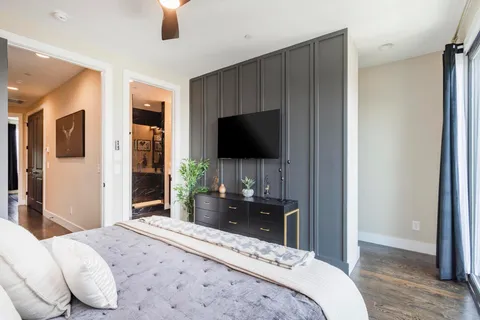 an aerial view of a house with a garden and lake view