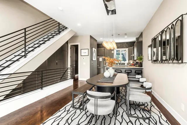 a living room with furniture and a lamp