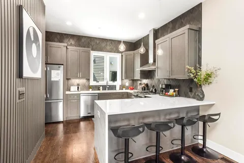 a bedroom with a large bed and a couch