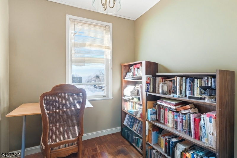 420 Mechanic Street Orange, NJ 07050 - Photo 8 of 18 a work room with furniture book shelf and a window