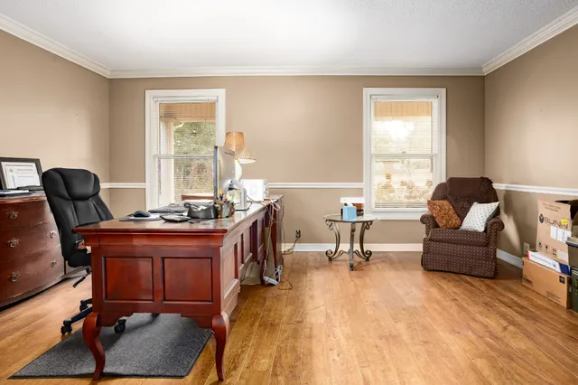 a bedroom with furniture and window