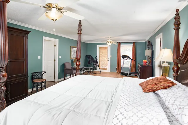 a bathroom with a tub a sink and a large mirror