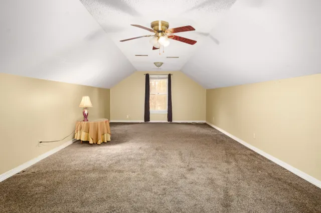 a very nice looking room with a ceiling fan