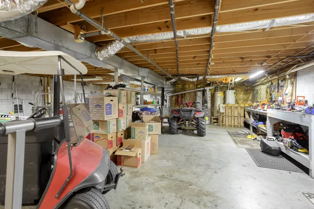 a dining room with furniture and large windows
