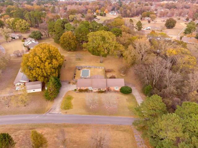a view of swimming pool with a patio and a yard