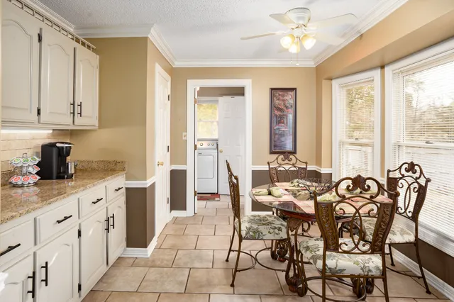 a kitchen with a stove a sink and a refrigerator