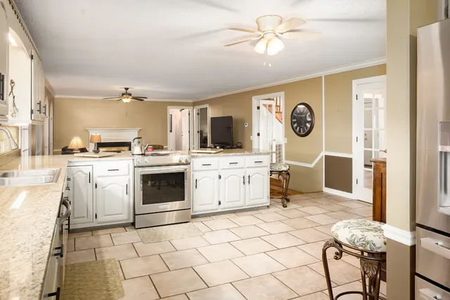 a view of a entryway with furniture and floor to ceiling window
