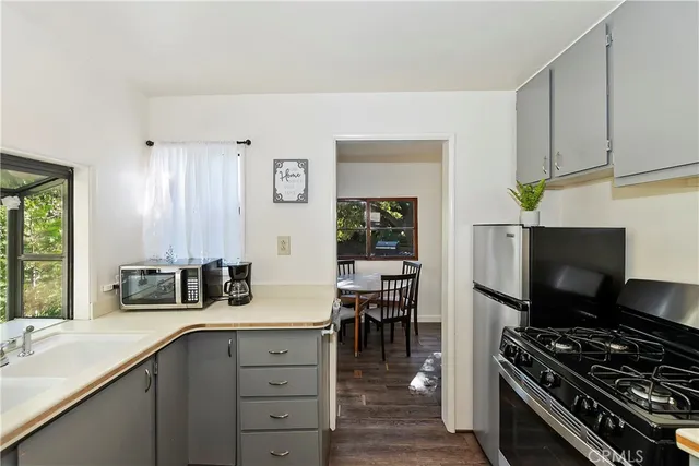 a kitchen with a stove and a sink