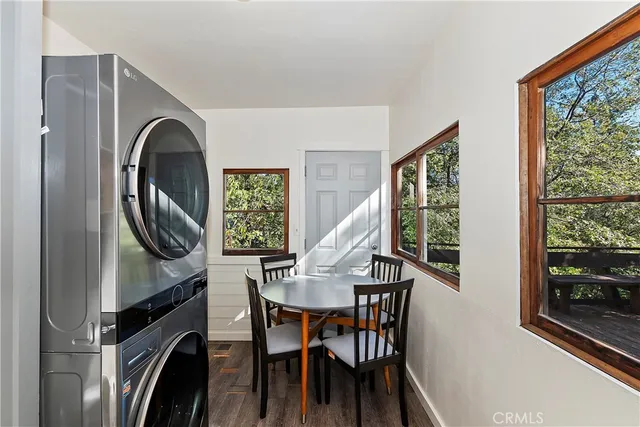 a view of a livingroom with furniture and a window