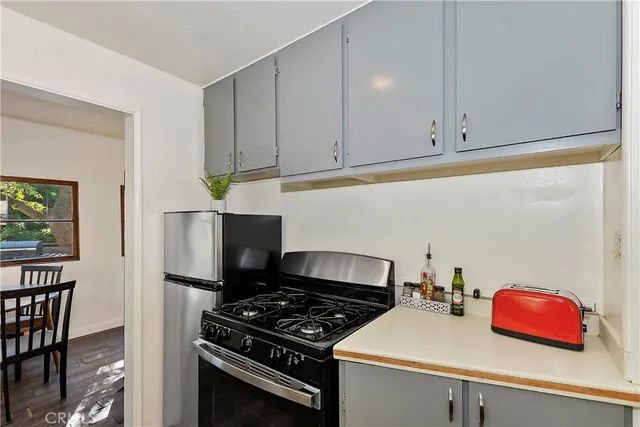 a kitchen with cabinets and appliances