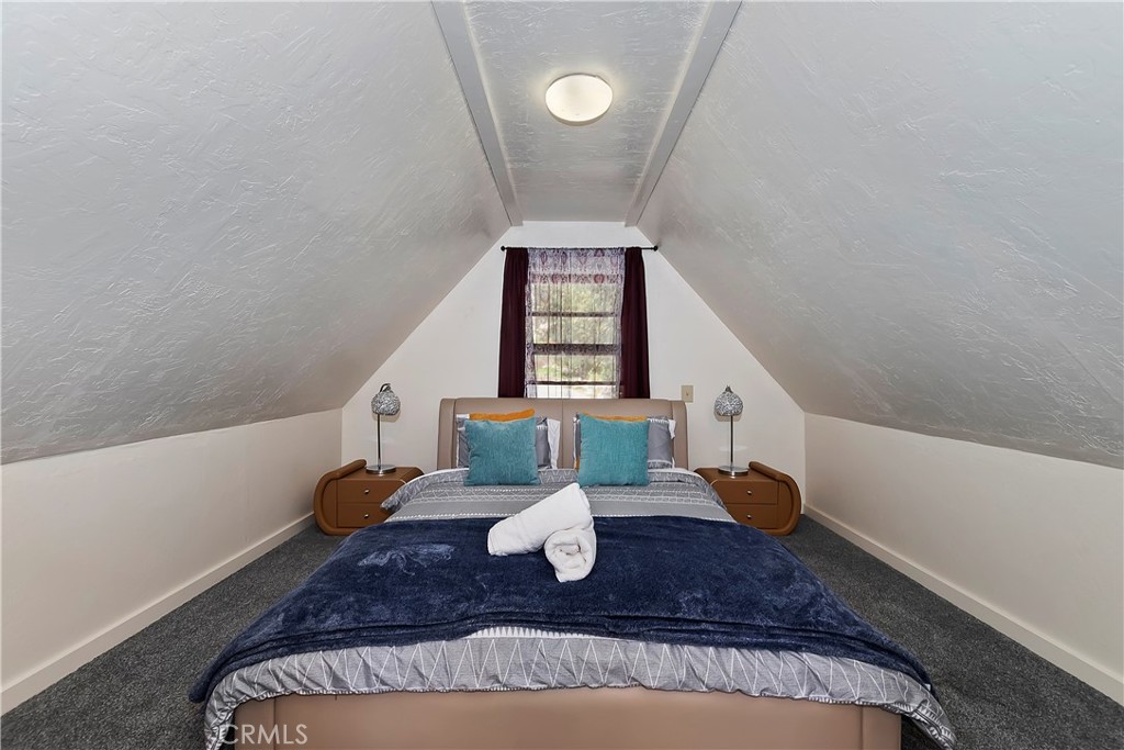 1262 Bear Springs Road Rimforest, CA 92378 - Photo 22 of 34 a view of a living room with a rug