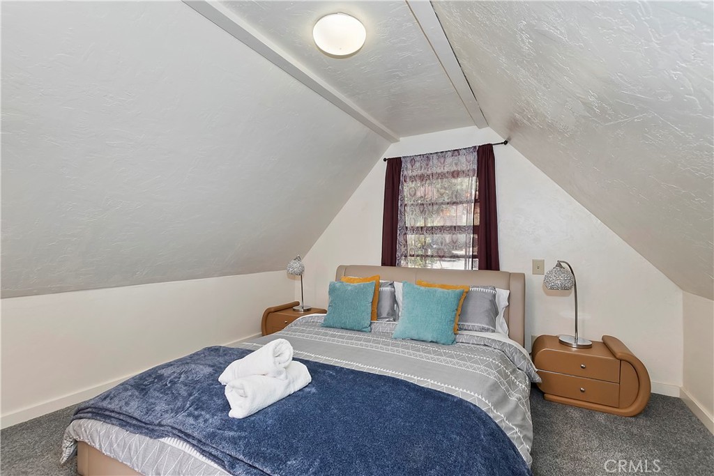 1262 Bear Springs Road Rimforest, CA 92378 - Photo 24 of 34 a bedroom with a bed and a window