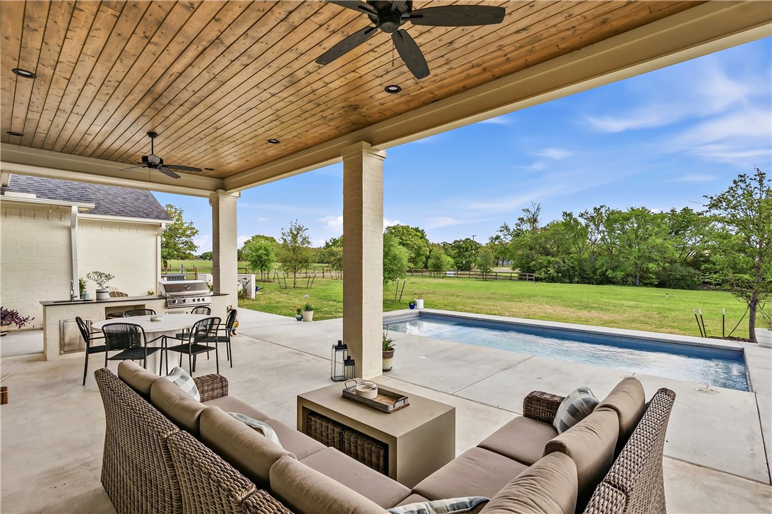 10701 Harvey Ranch Road College Station, TX 77845 - Photo 42 of 48 a living room with patio furniture and garden view