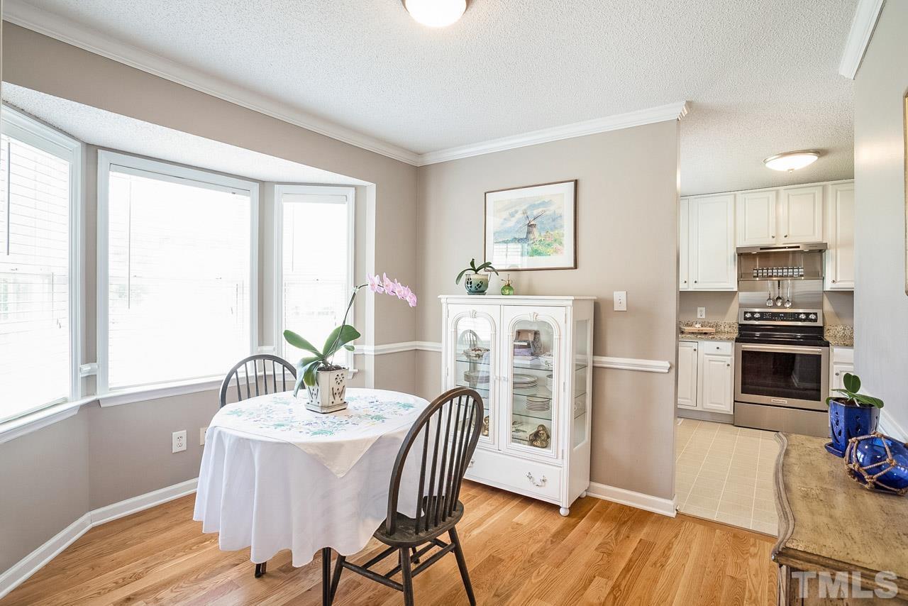 1140 Feldmen Drive Raleigh, NC 27603 - Photo 5 of 27 a dining room with furniture and wooden floor