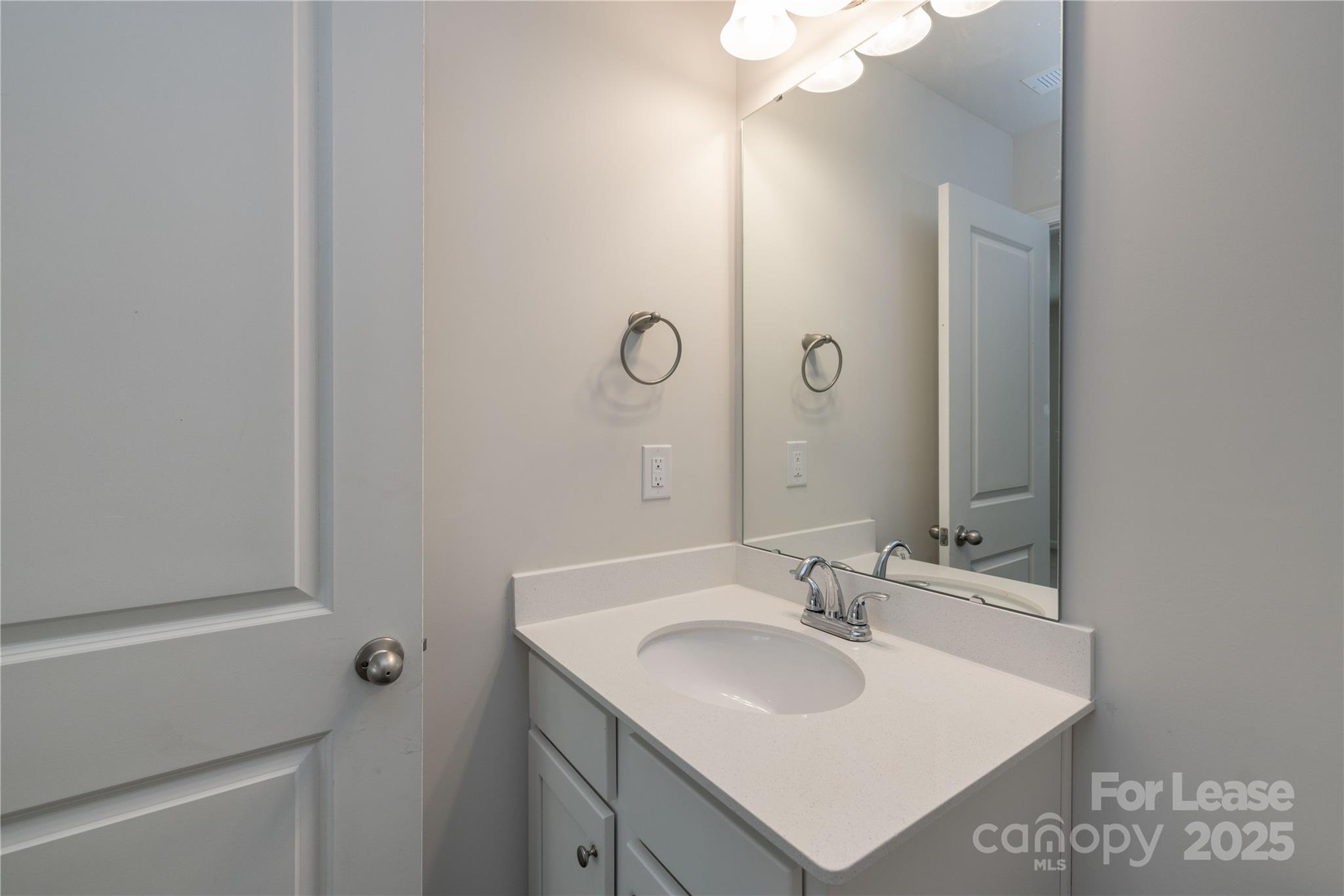 146 South Bell Avenue Albemarle, NC 28001 - Photo 25 of 36 a bathroom with a sink and a mirror