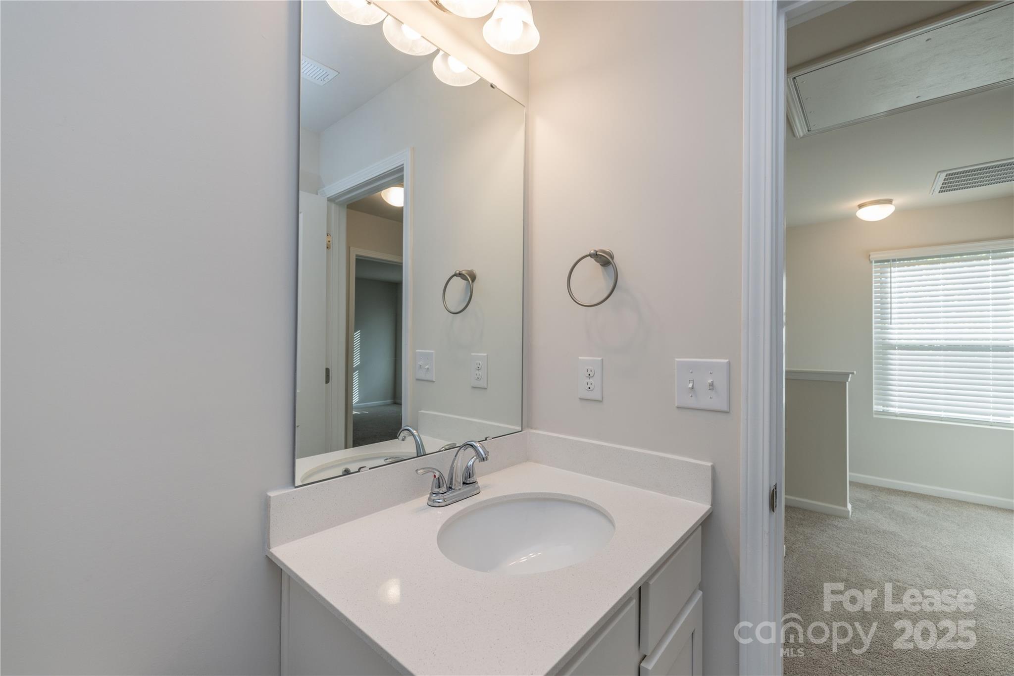146 South Bell Avenue Albemarle, NC 28001 - Photo 30 of 36 a bathroom with a sink and a mirror