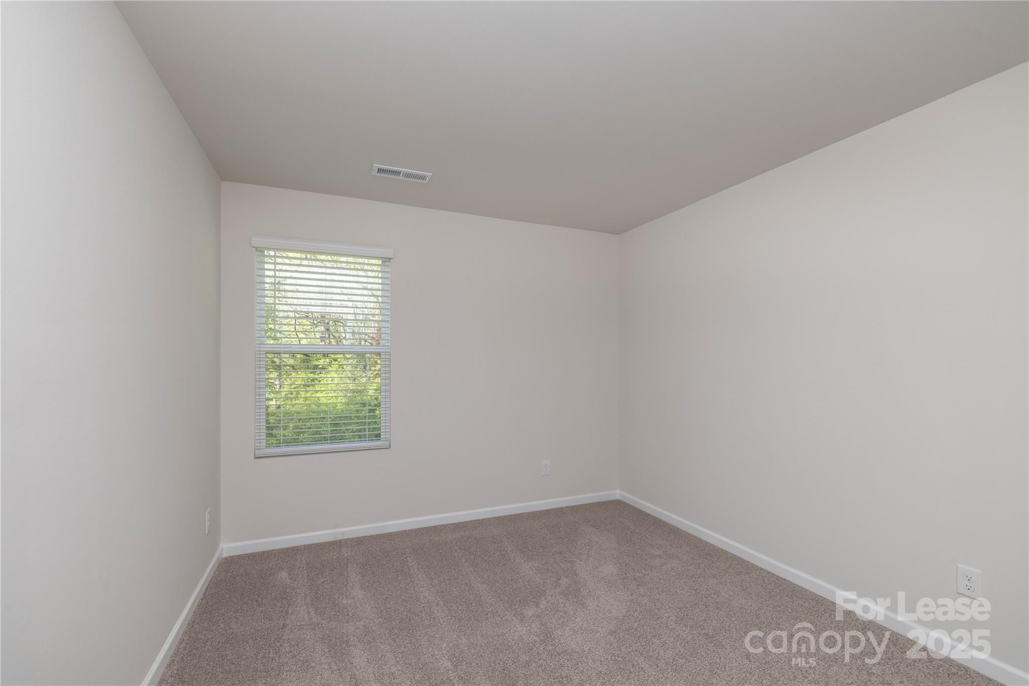 146 South Bell Avenue Albemarle, NC 28001 - Photo 31 of 36 an empty room with a window