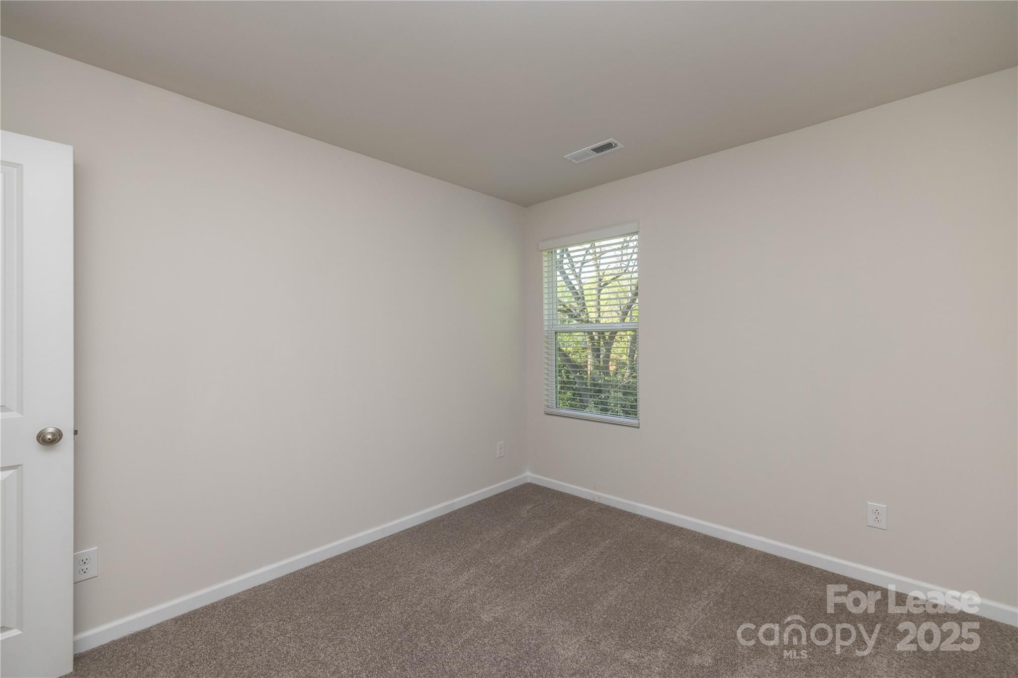 146 South Bell Avenue Albemarle, NC 28001 - Photo 32 of 36 an empty room with a window