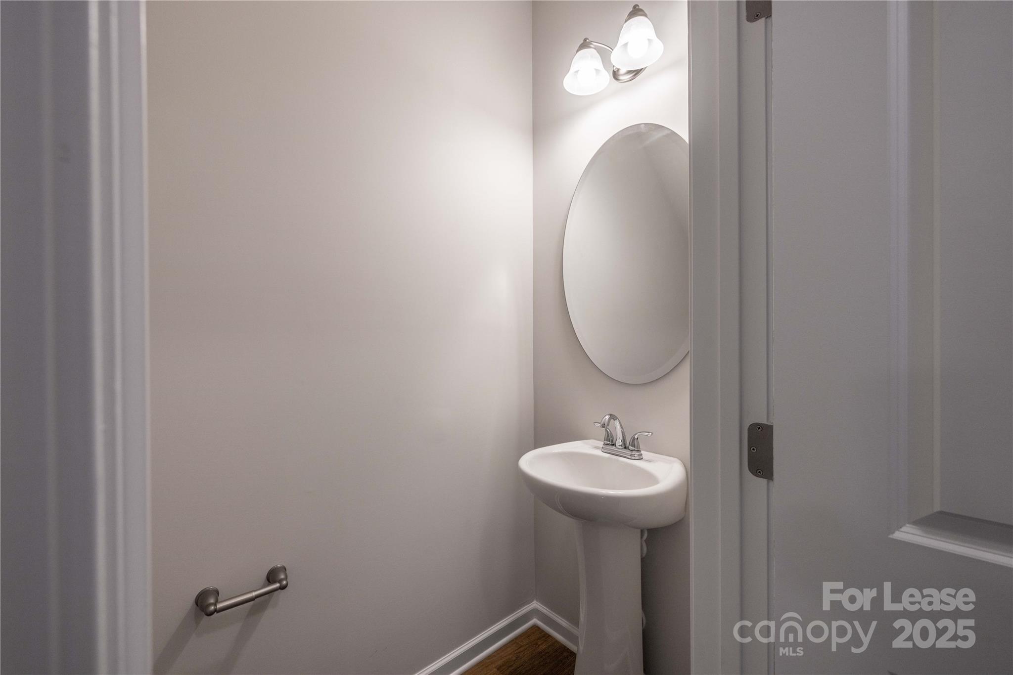 146 South Bell Avenue Albemarle, NC 28001 - Photo 35 of 36 a bathroom with a sink and a mirror