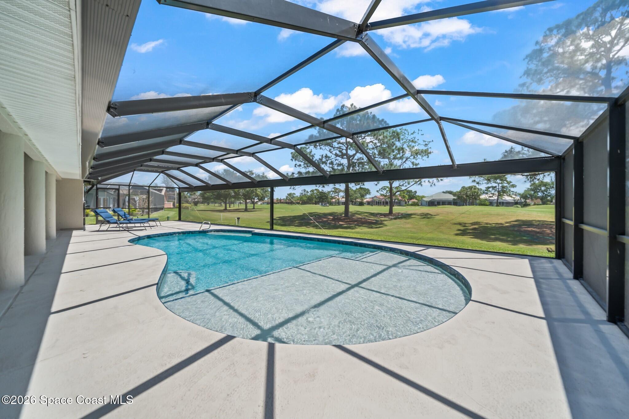 697 Spring Lake Drive Melbourne, FL 32940 - Photo 31 of 45 a view of a indoor swimming pool