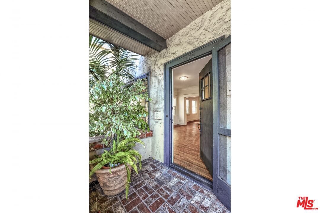 1126 Mohawk Street Los Angeles, CA 90026 - Photo 15 of 47 a hallway with a potted plant on the side