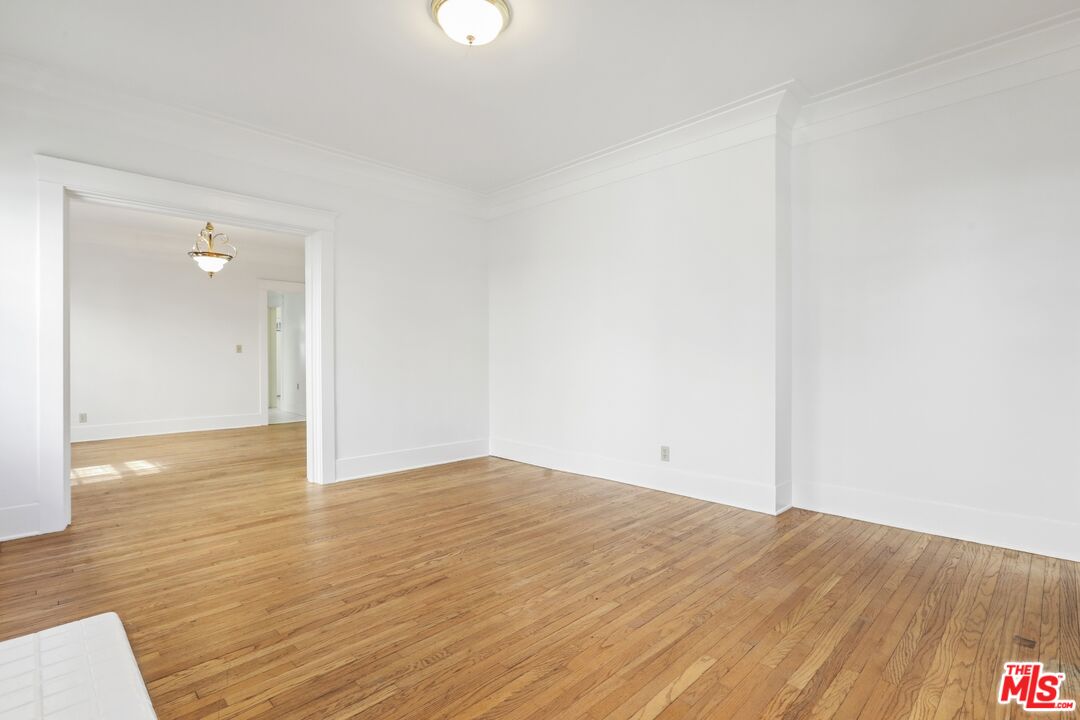 1126 Mohawk Street Los Angeles, CA 90026 - Photo 19 of 47 a view of empty room with wooden floor