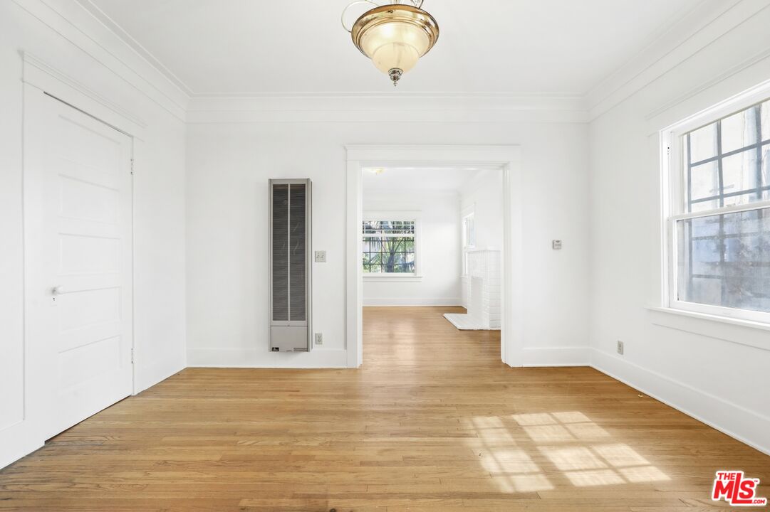 1126 Mohawk Street Los Angeles, CA 90026 - Photo 20 of 47 a view of a livingroom with wooden floor and a window