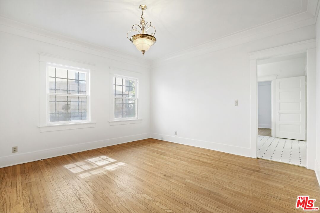1126 Mohawk Street Los Angeles, CA 90026 - Photo 21 of 47 wooden floor in an empty room with a window