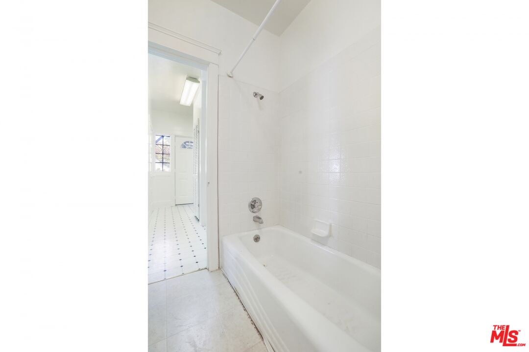 1126 Mohawk Street Los Angeles, CA 90026 - Photo 25 of 47 a bathroom with a bathtub and a shower
