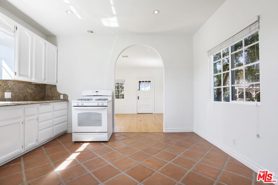 1126 Mohawk Street Los Angeles, CA 90026 - Photo 40 of 47 a view of kitchen with granite countertop cabinets and window