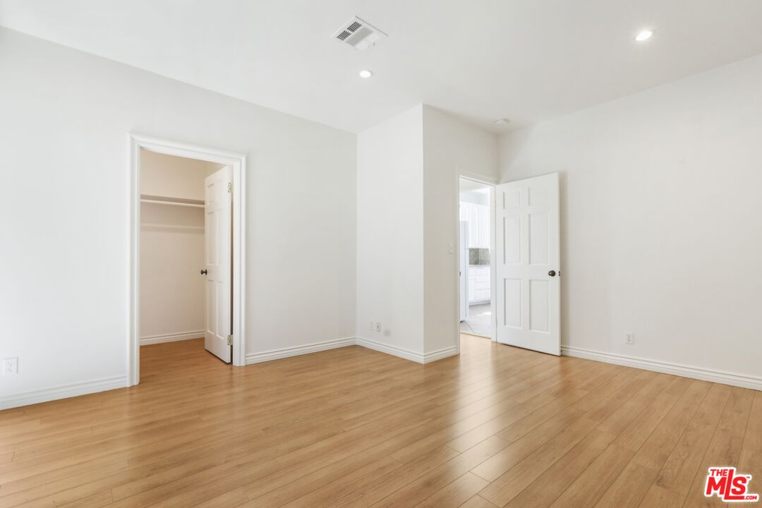 1126 Mohawk Street Los Angeles, CA 90026 - Photo 45 of 47 a view of an empty room with wooden floor