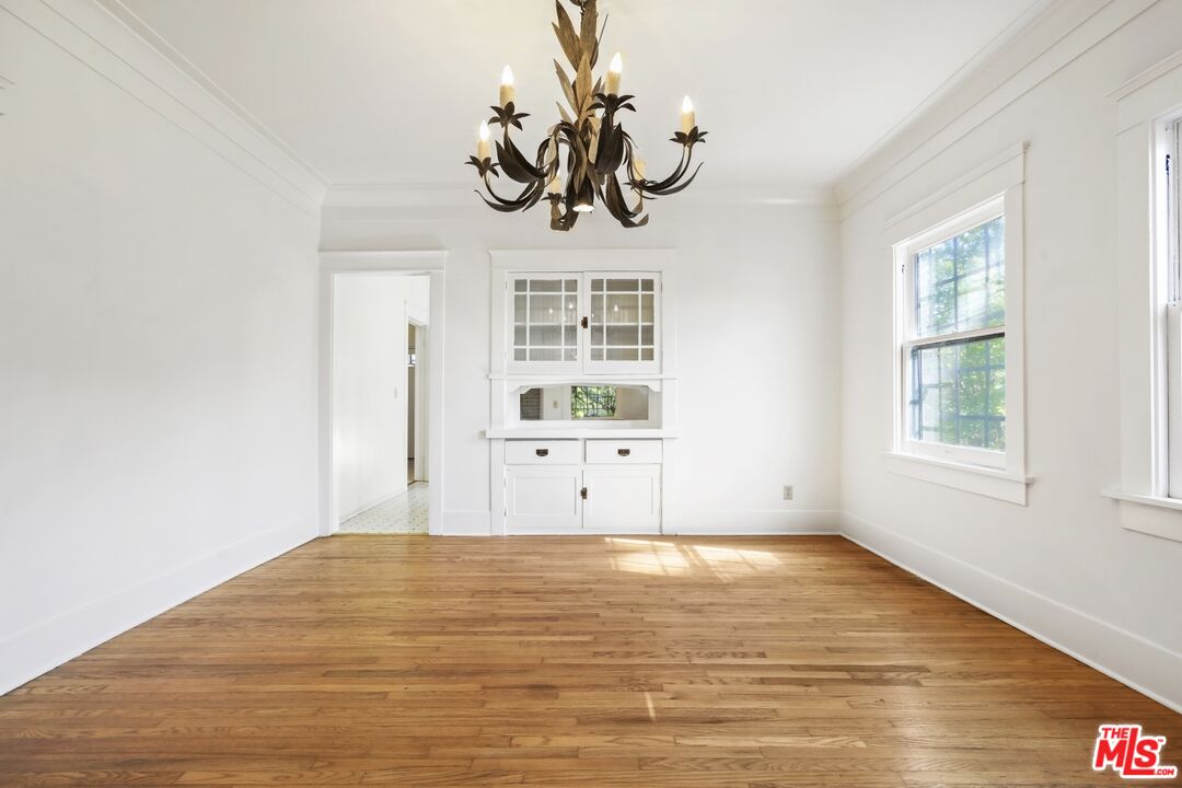 1126 Mohawk Street Los Angeles, CA 90026 - Photo 5 of 47 a view of a room with wooden floor and window