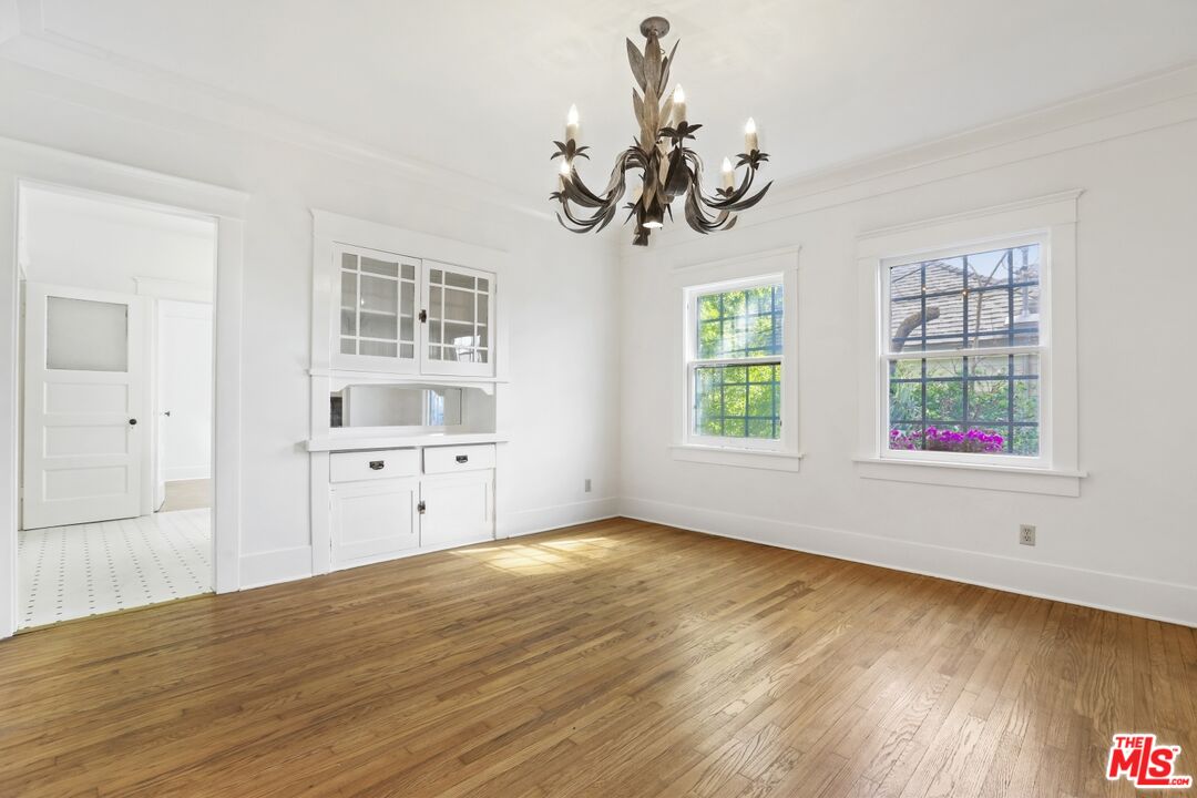 1126 Mohawk Street Los Angeles, CA 90026 - Photo 6 of 47 wooden floor in an empty room with a window