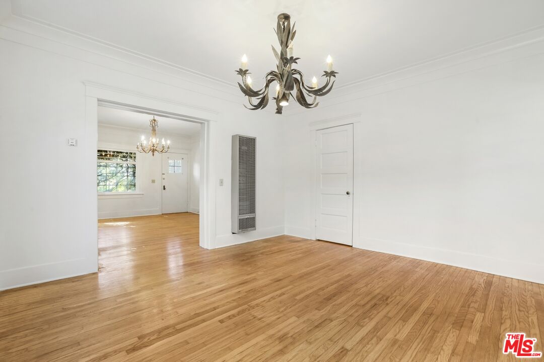 1126 Mohawk Street Los Angeles, CA 90026 - Photo 7 of 47 a view of a room with wooden floor and ceiling fan