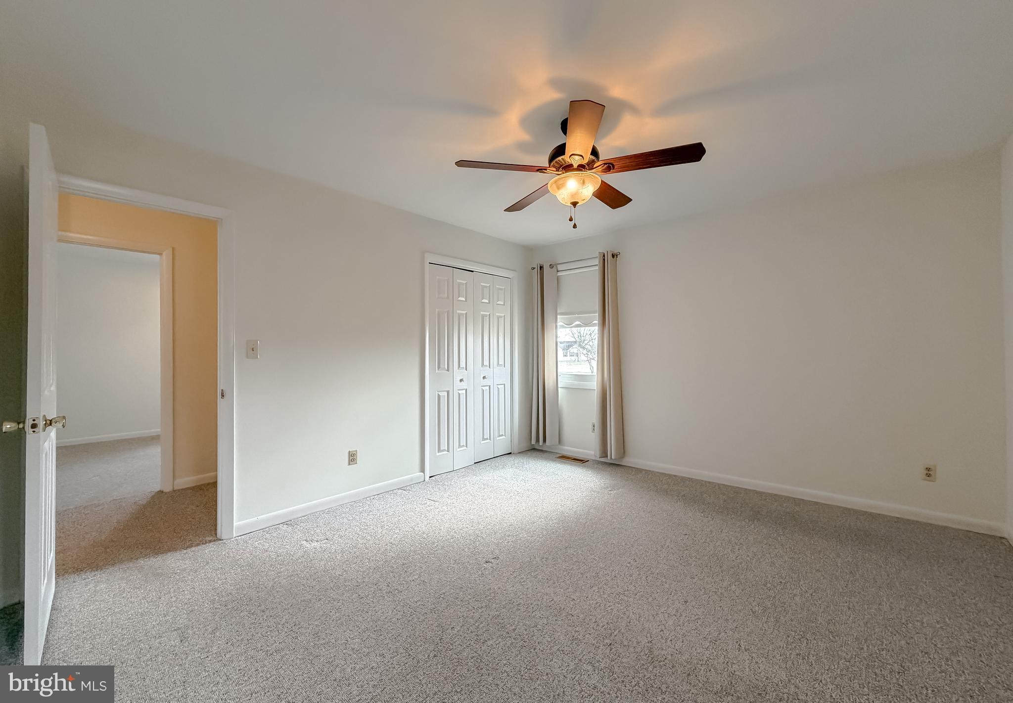 7615 Mill Creek Road Benedict, MD 20612 - Photo 16 of 37 an empty room with a empty space and a ceiling fan