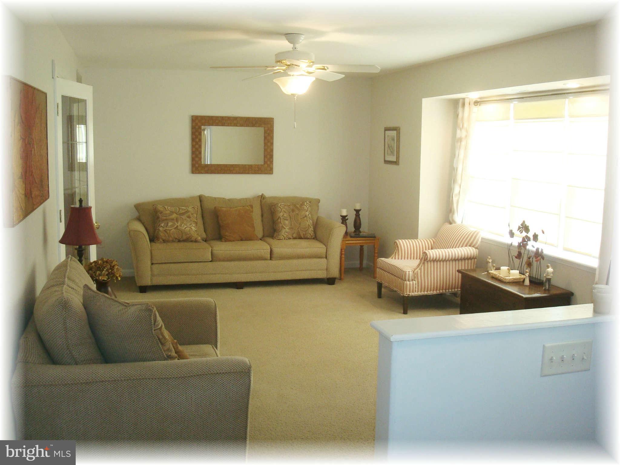 301 Bowleys Quarters Road Baltimore, MD 21220 - Photo 11 of 30 a living room with furniture and a large window